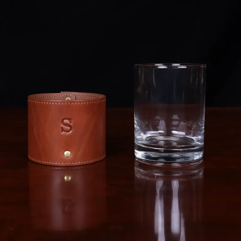 leather veranda glass sleeve and on wooden table with dark background