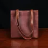 No. 9B Leather Tote in Vintage Brown - back view - on wood table with dark background