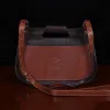 back of No. 17 Hunt Bag made of two-tone brown American Buffalo and Vintage Brown Steerhide leather with logo stamp