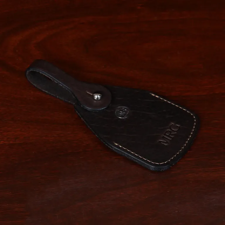 side view Tobacco Brown American Buffalo Luggage Tag on wood table with CL Buffalo