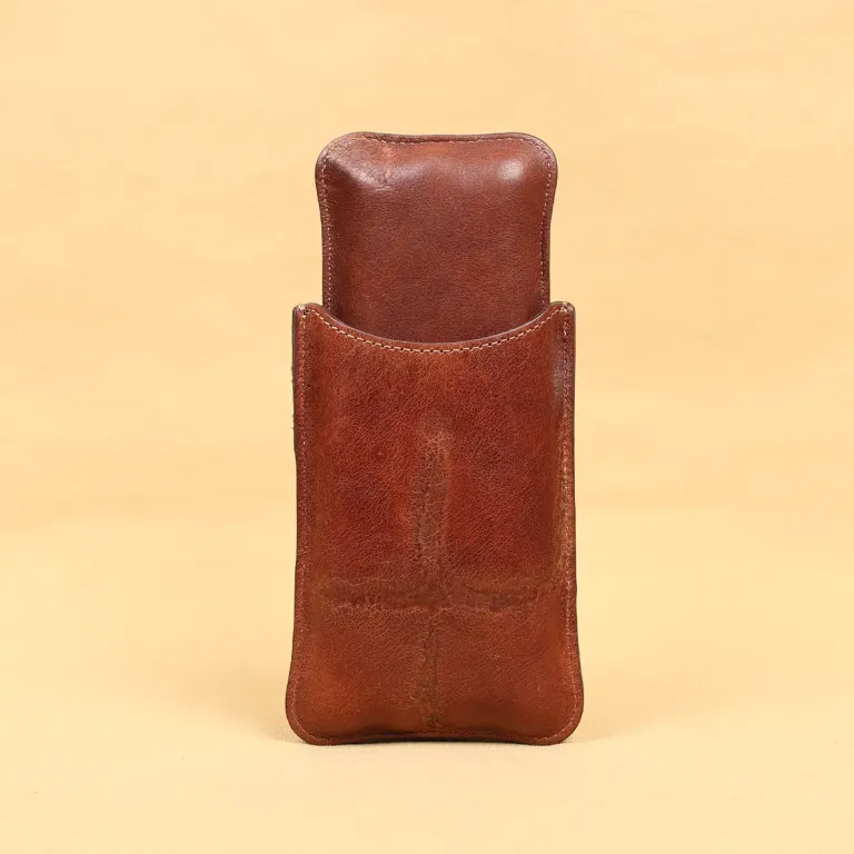 The front side of a American Steerhide and American Alligator leather cigar case with brass hardware.