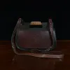 back view of the hunt bag in buffalo and alligator leather