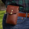 No 49l Phone Holster in vintage brown showing on a man
