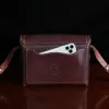 buffalo leather crossbody box bag on table -back view with iphone