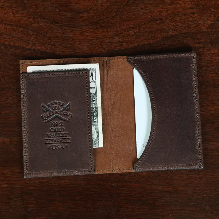 No. 2 card wallet in Vintage Brown American Alligator - ID 001 - open view with card and cash on a wood table and dark background