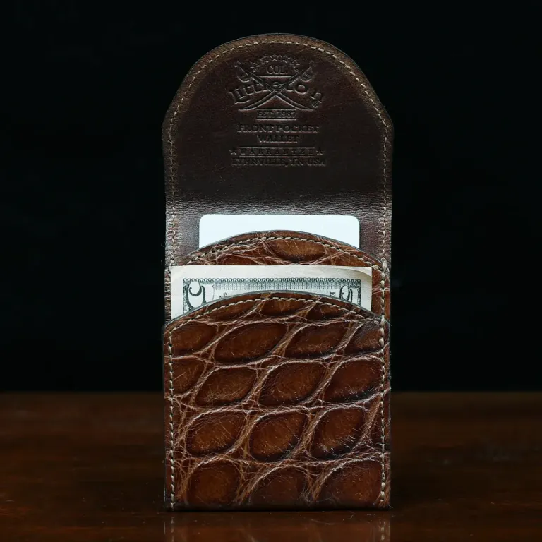 Alligator - front open view - 001 - on wood table with a dark background