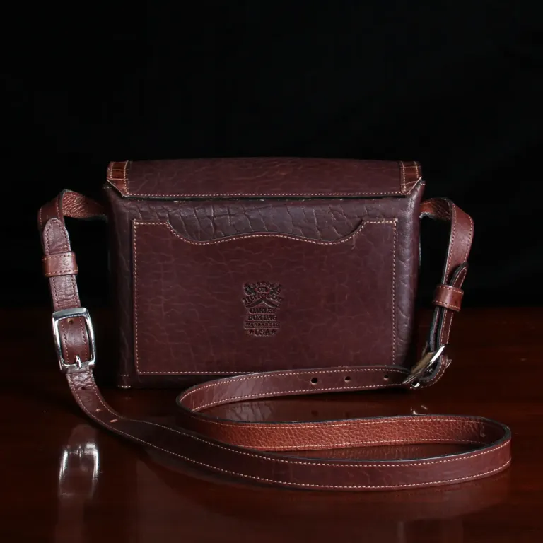 buffalo leather crossbody box bag on table - back view