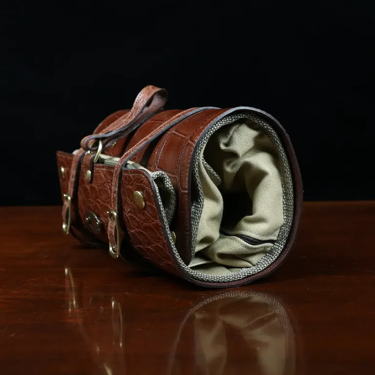 CL - No. 2 Shave Dopp Kit in Vintage Brown American Alligator with No. 8 Khaki Cotton Canvas Lining - Serial Number 002 - side view on a wooden table