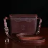 buffalo leather crossbody box bag on table - back view