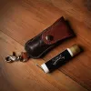 Tobacco Brown American Buffalo Lip Balm Holder with Lip Balm on wood table