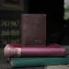 no 1 tri fold wallet in tobacco buffalo on books - front view