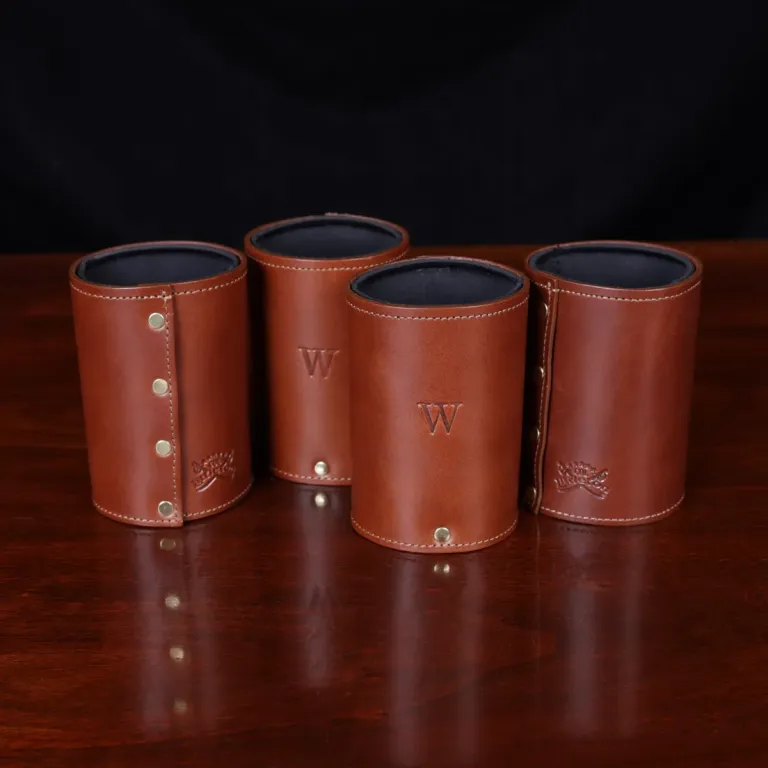 four of the can caddies showing the embossed stamp and the backside
