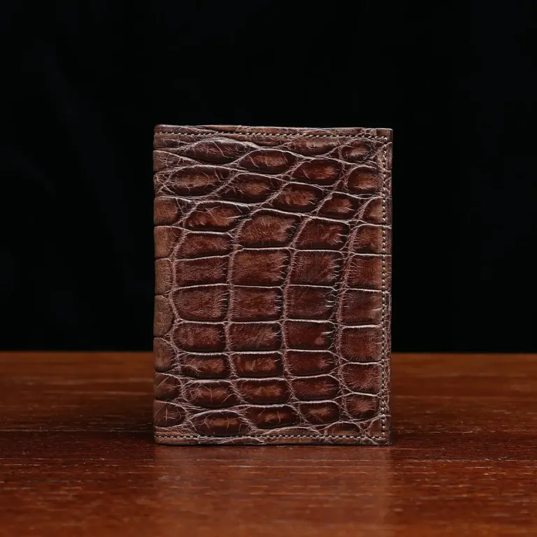 No. 2 card wallet in Vintage Brown American Alligator - ID 001 - front view on a wood table and dark background