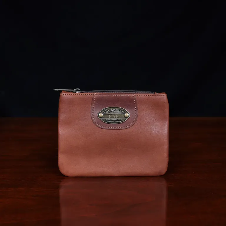 no1 brown leather small zip it bag - front view - on wooden table