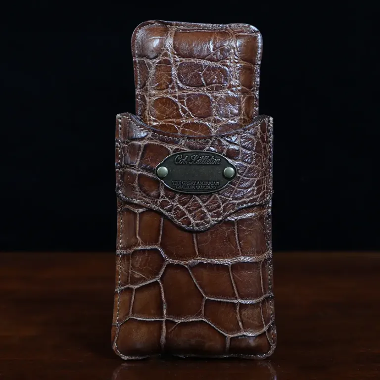 A leather Cigar Case in American Alligator showing the front with brass hardware - id 002