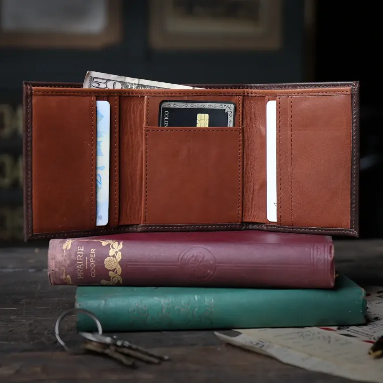 no 1 tri fold wallet in tobacco buffalo on dark background - open view with money