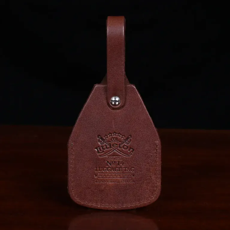 vintage brown luggage id with product stamp