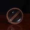 bottom view of leather veranda glass sleeve on wooden table with dark background