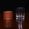 leather veranda glass sleeve and on wooden table with dark background