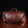No. 5 Grip in Vintage Brown Steerhide - back view- on a wood table with a dark background