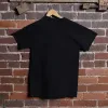 Back of a black colonel littleton tshirt