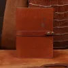 Rugged leather portfolio showing the front with brass hardware.