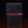 no 18 portfolio in vintage brown and black sitting on a table