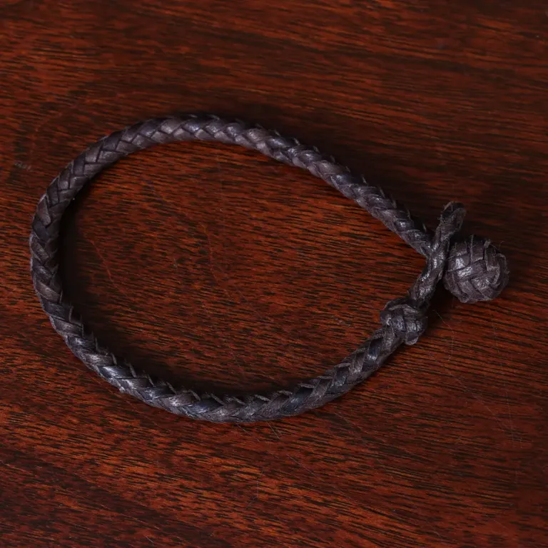 braided brown leather bracelet with and loop closure - top view