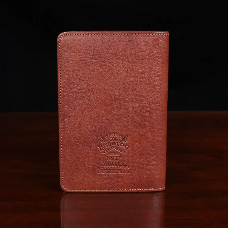 no27 vintage brown passport wallet back view with black background