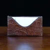 No. 3 Card Wallet in Vintage Brown American Alligator - ID 003 - front view with business card cut out on No. 2 Card Wallet in Vintage Brown American Alligator - ID 001 - front view on a black background