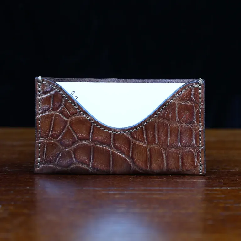 No. 3 Card Wallet in Vintage Brown American Alligator - ID 003 - front view with business card cut out on No. 2 Card Wallet in Vintage Brown American Alligator - ID 001 - front view on a black background