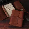 American Steerhide leather journal front and open view sitting on table with wrist watch, pencil and reading glasses