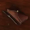 No. 48XL phone holster in tobacco buffalo and vintage brown - open view of phone holster on a wood table