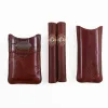 The front side of a Authentic Branded American Steerhide and American Alligator trim leather cigar case with brass hardware.