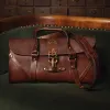 leather travel bag on green couch