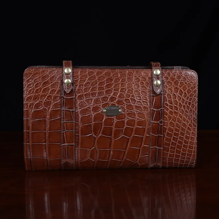 No.18 legal portfolio in alligator front view - id 001- on wooden table with black background